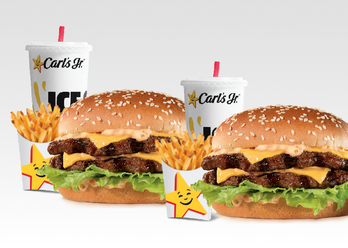 2 Big Carl burger combos with fries and drinks
