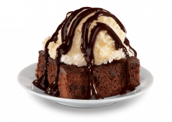 ice cream scoop on brownie with chocolate sauce